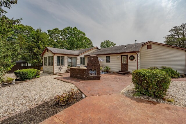 5 Edwards Ter, Seaville, NJ 08230 - single story home with exterior fireplace, a patio area, and a shingled roof