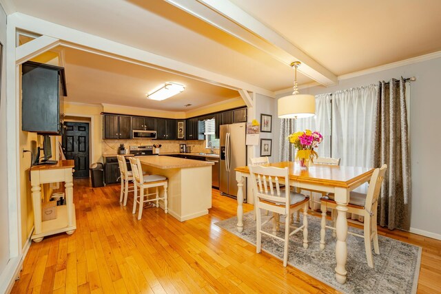 5 Edwards Ter, Seaville, NJ 08230 - dining area with light wood-type flooring, beam ceiling, and crown molding