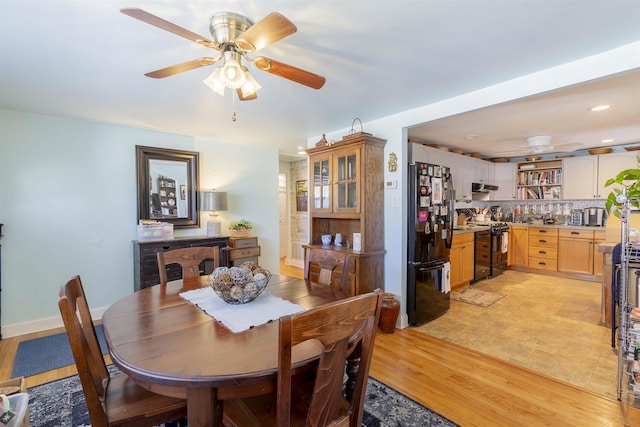 dining area featuring light wood-style flooring, baseboards, ceiling fan, and recessed lighting