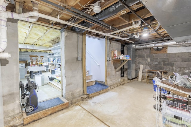 unfinished basement featuring stairs