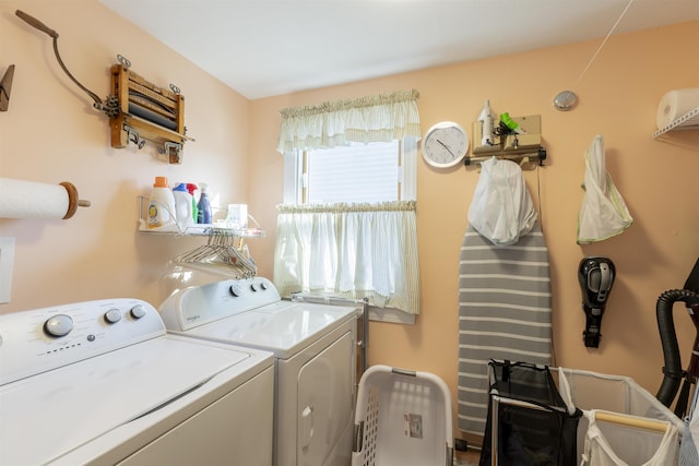 clothes washing area featuring laundry area and washing machine and clothes dryer