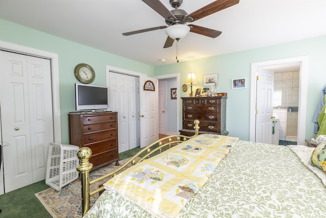 carpeted bedroom with ceiling fan and two closets