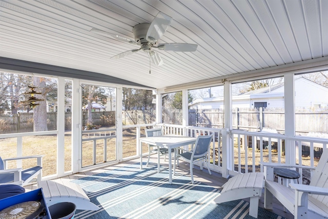 sunroom / solarium featuring vaulted ceiling and ceiling fan