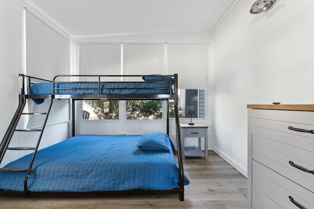 bedroom featuring wood finished floors