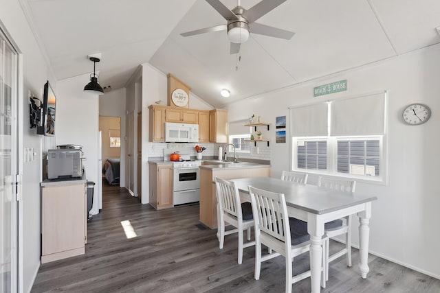 kitchen with white appliances, dark wood-type flooring, decorative light fixtures, light brown cabinetry, and a sink