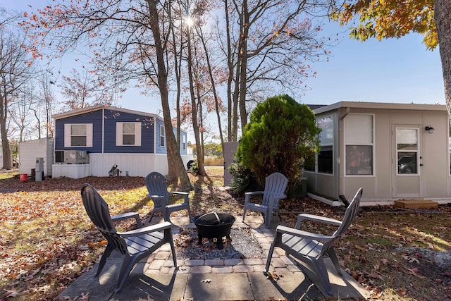 view of patio / terrace featuring an outdoor fire pit