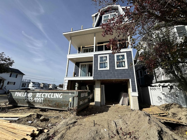 view of front of home featuring a balcony