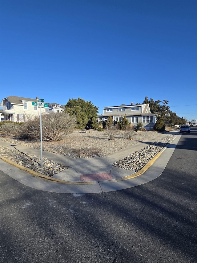 view of road featuring curbs and sidewalks