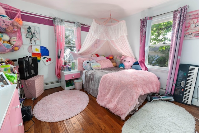 222 E 2nd Ave, North Wildwood, NJ 08260 - bedroom with multiple windows, wood finished floors, and baseboard heating