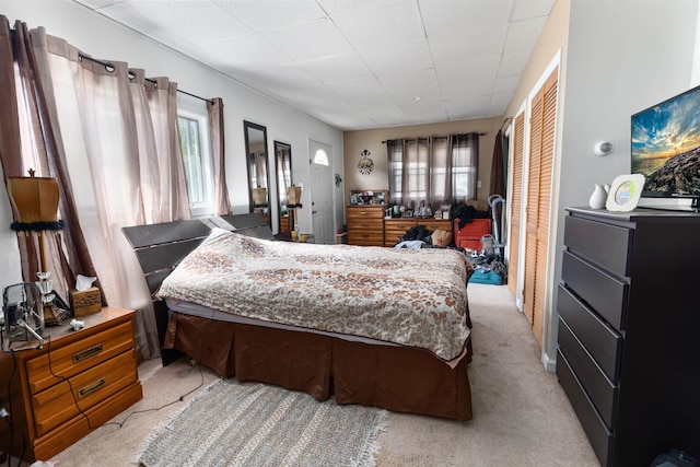 222 E 2nd Ave, North Wildwood, NJ 08260 - bedroom with multiple windows, light colored carpet, and a drop ceiling