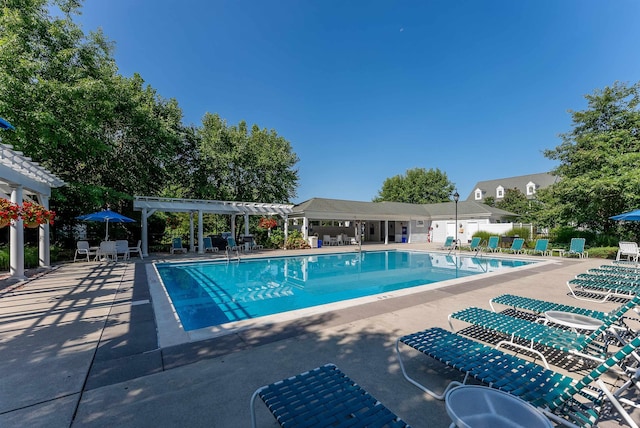 view of pool with a pergola and a patio area