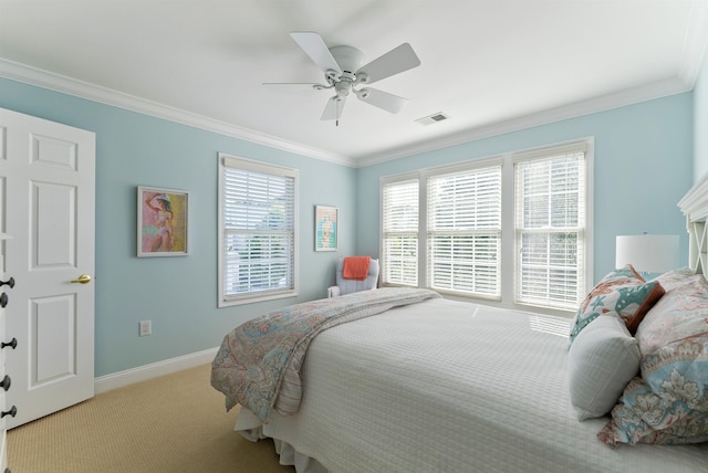 bedroom with ceiling fan, crown molding, and light carpet