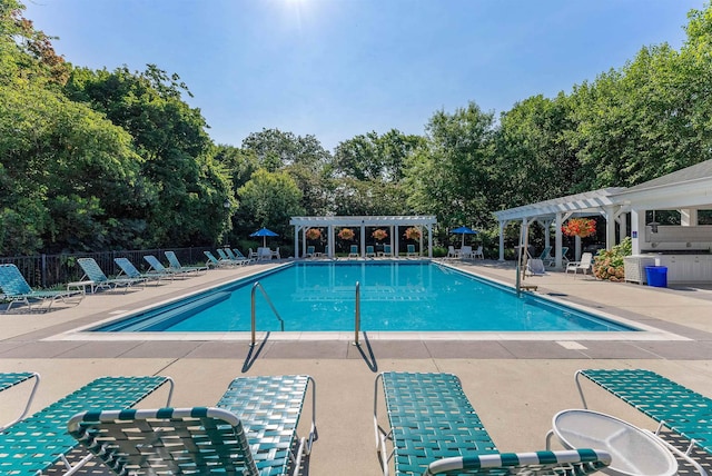 view of swimming pool with a pergola and a patio area