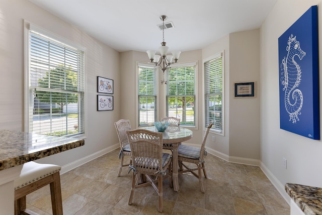 dining area featuring an inviting chandelier