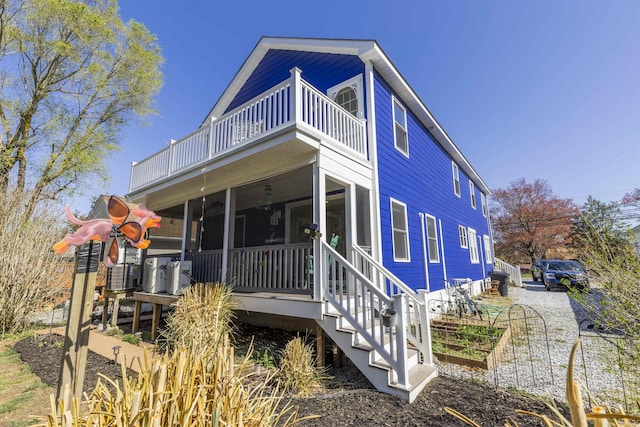 151 Stimpson Ln, West Cape May, NJ 08204 - view of front of property with a balcony, central AC, and a sunroom