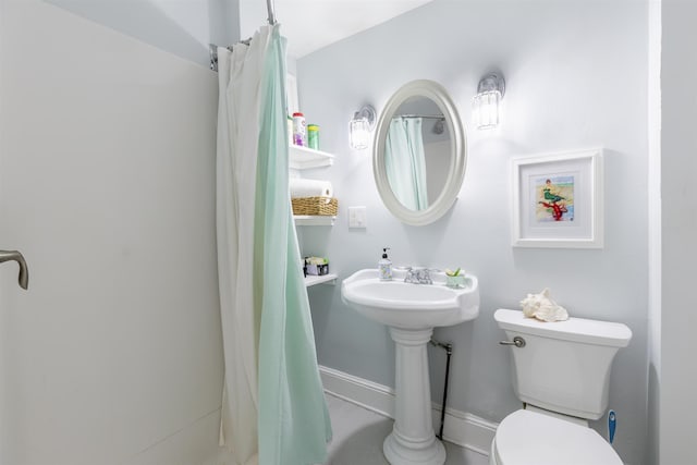 151 Stimpson Ln, West Cape May, NJ 08204 - full bathroom with toilet, a sink, and baseboards