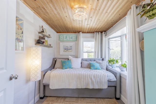 151 Stimpson Ln, West Cape May, NJ 08204 - bedroom with wood ceiling and a chandelier