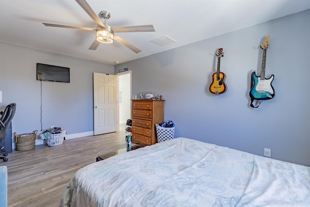 151 Stimpson Ln, West Cape May, NJ 08204 - bedroom featuring light wood-style flooring, a ceiling fan, and baseboards