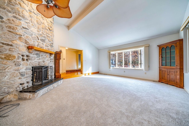 unfurnished living room with high vaulted ceiling, a fireplace, carpet flooring, baseboards, and beamed ceiling