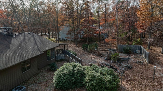 view of yard with a garden and central AC