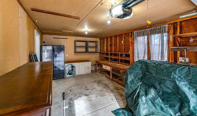 interior space featuring a garage and unfinished concrete flooring