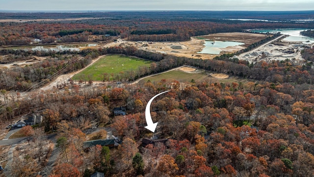 bird's eye view featuring a forest view