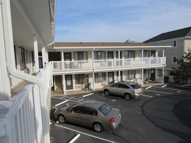 view of building exterior featuring uncovered parking