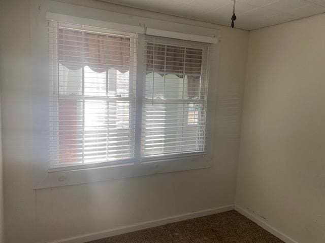 unfurnished room featuring carpet flooring