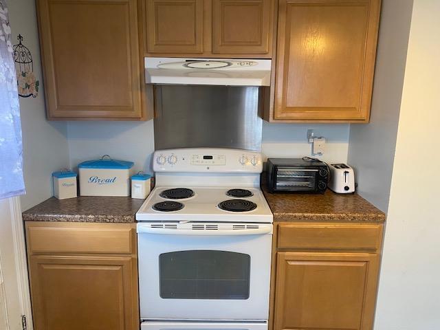 kitchen with white electric range oven