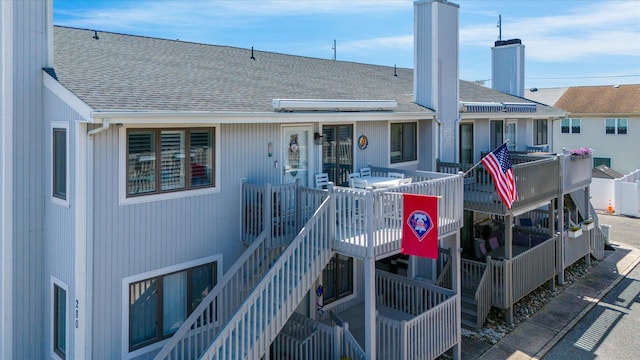 280 79th St Unit 2, Avalon, NJ 08202 - back of house featuring a shingled roof and a chimney