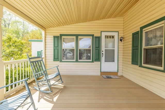 entrance to property featuring a porch