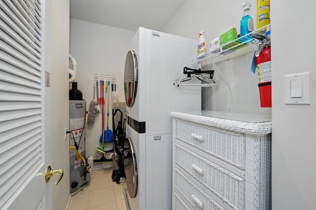 305 E Bennett Ave Unit A, Wildwood, NJ 08260 - laundry room featuring estacked washer and dryer, light tile patterned flooring, and gas water heater