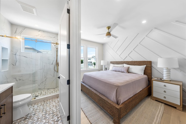 242 83rd St, Stone Harbor, NJ 08247 - bedroom with multiple windows, light wood-type flooring, connected bathroom, and a ceiling fan