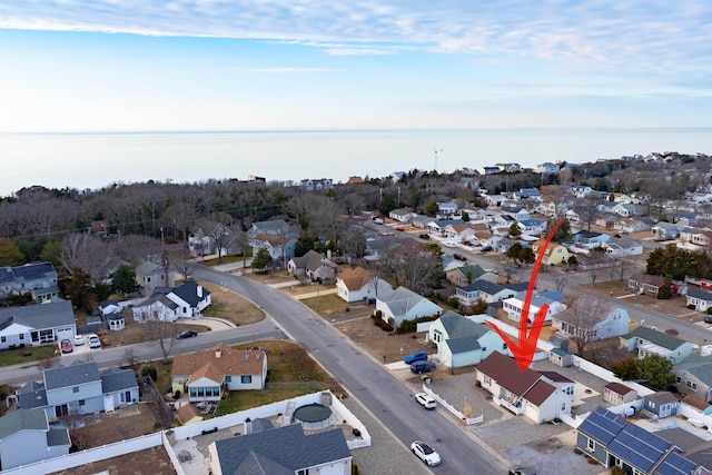 birds eye view of property featuring a water view and a residential view