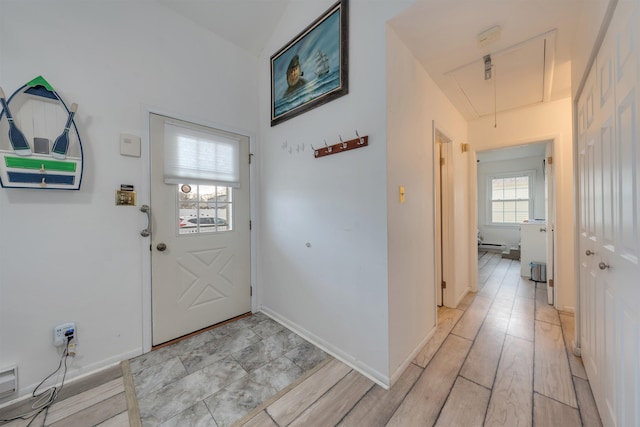 entrance foyer featuring light wood-style floors and baseboards