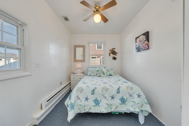 bedroom with ceiling fan, a baseboard heating unit, carpet floors, visible vents, and baseboards