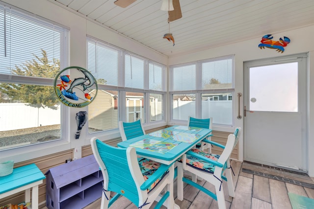 sunroom / solarium with ceiling fan