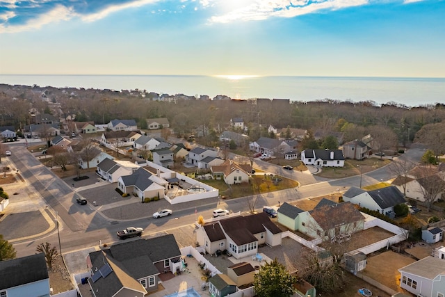 bird's eye view with a water view and a residential view