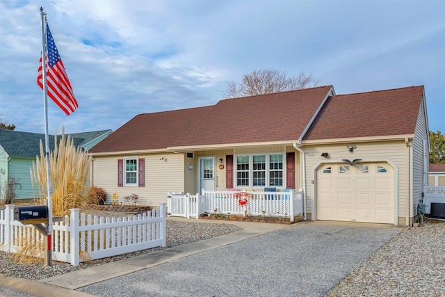 single story home with a porch, a fenced front yard, aphalt driveway, a garage, and roof with shingles