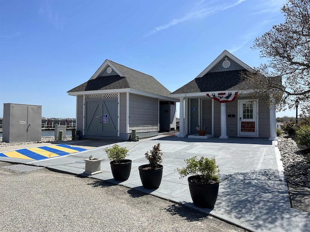 view of front of home with an outdoor structure