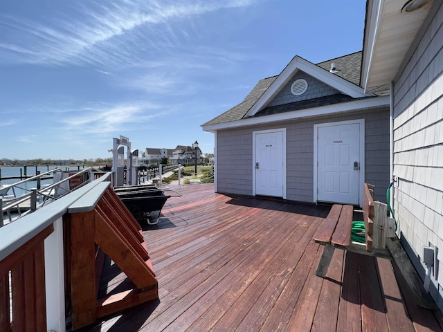 wooden deck featuring a water view