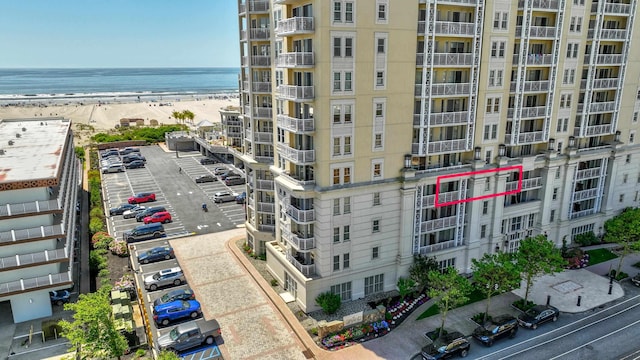 aerial view featuring a water view and a view of the beach