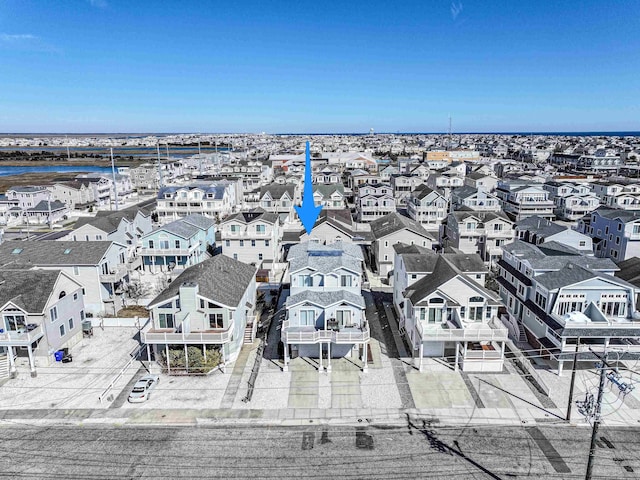 birds eye view of property featuring a residential view and a water view