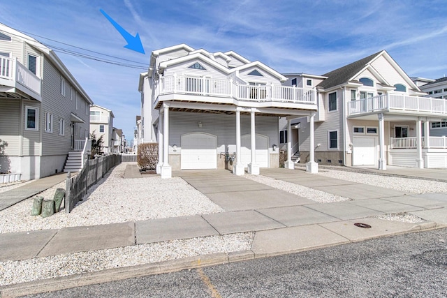 view of front of house with a garage, driveway, and a residential view