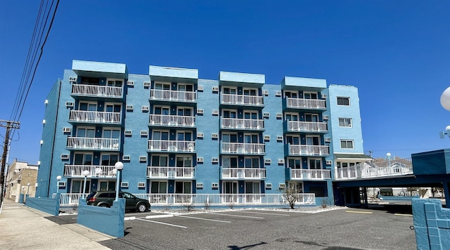 view of property featuring uncovered parking