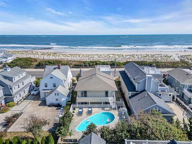 bird's eye view with a beach view and a water view