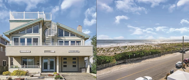 view of front of house featuring a water view, a beach view, and a balcony