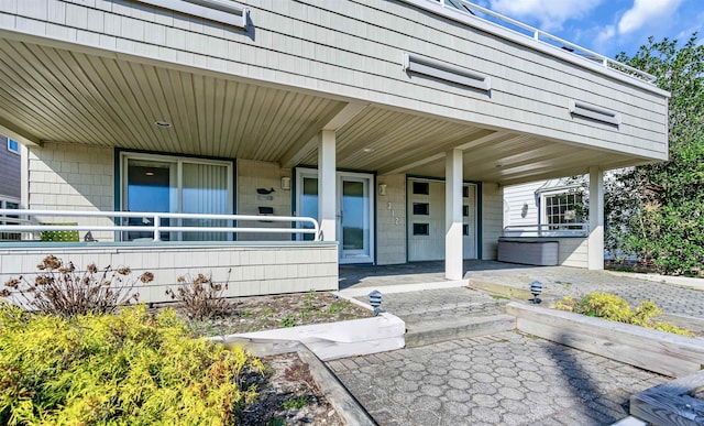 doorway to property with covered porch