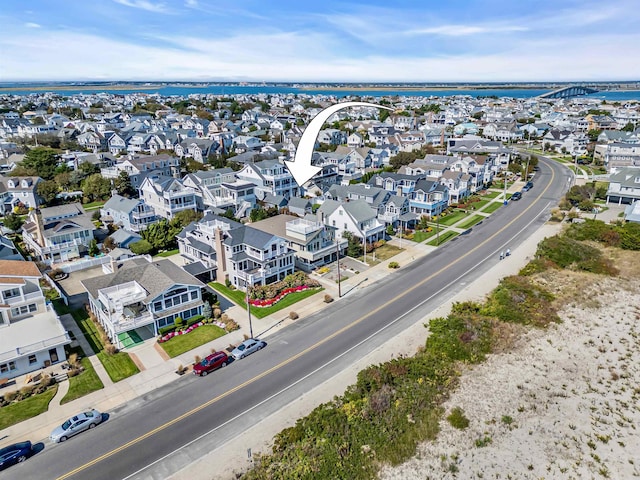 birds eye view of property featuring a residential view and a water view