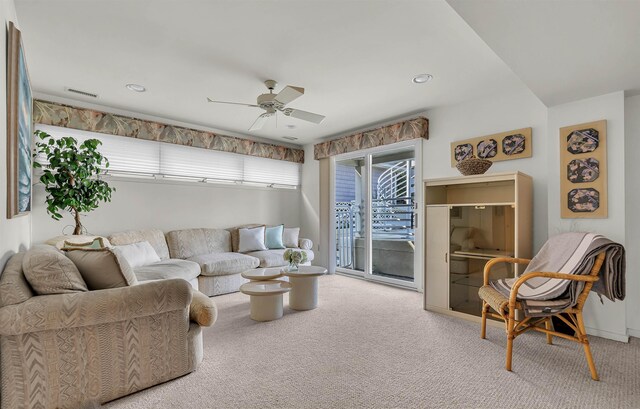 carpeted living area featuring visible vents, recessed lighting, and ceiling fan